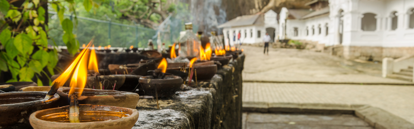 Sri Lanka- Dambulla-Oil lamps at Dambulla Golden Temple