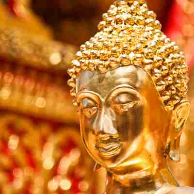 Gold face of Buddha statue in Doi Suthep temple, Chiang Mai, Thailand