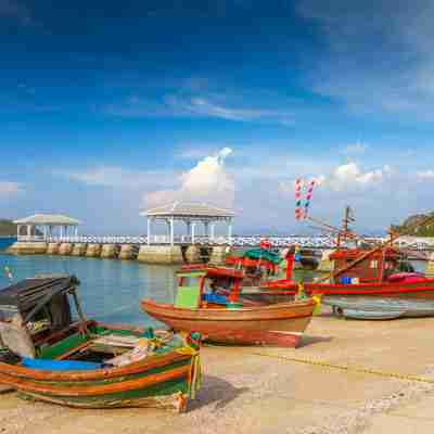 Fishing boats and wood waterfront pavilion, at Koh si chang island in Thailand_148477757